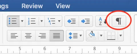 Mynd af page break merkinu í Word.